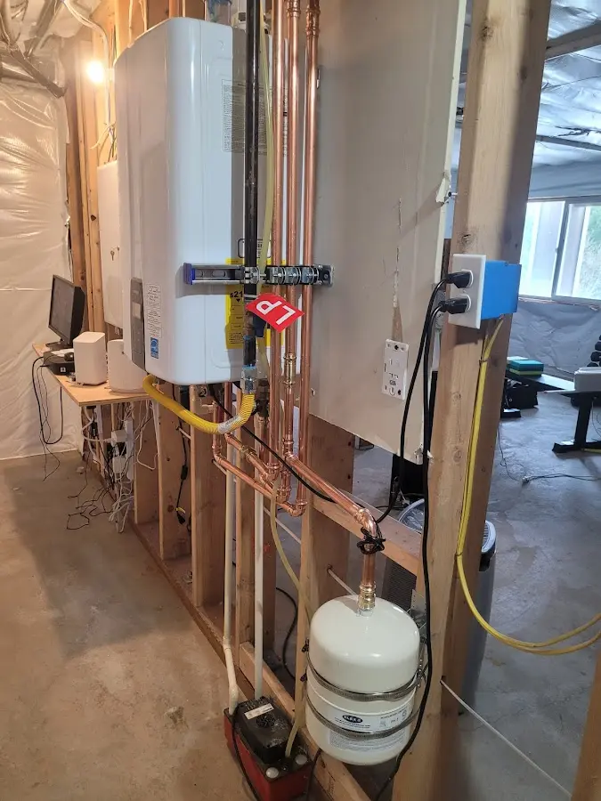 Licensed plumber repairing a kitchen sink in Hilton